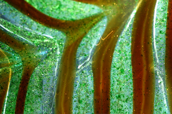 Detail of swirly vase, back-lit